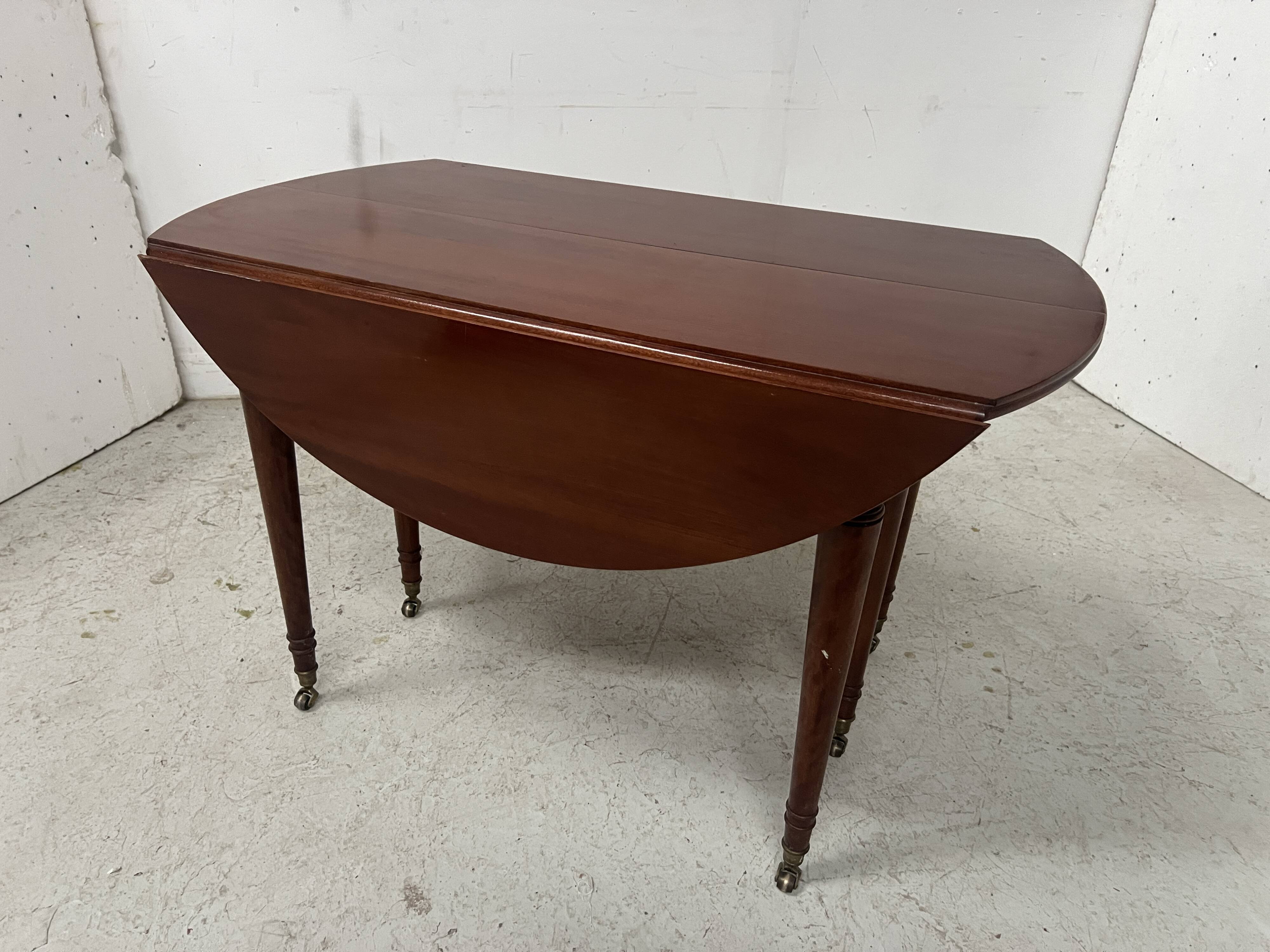 A six-foot Louis XVI style mahogany table from the 19th century.