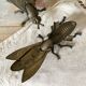 2 metal ashtrays with insect fly designs from the 1950s-60s.