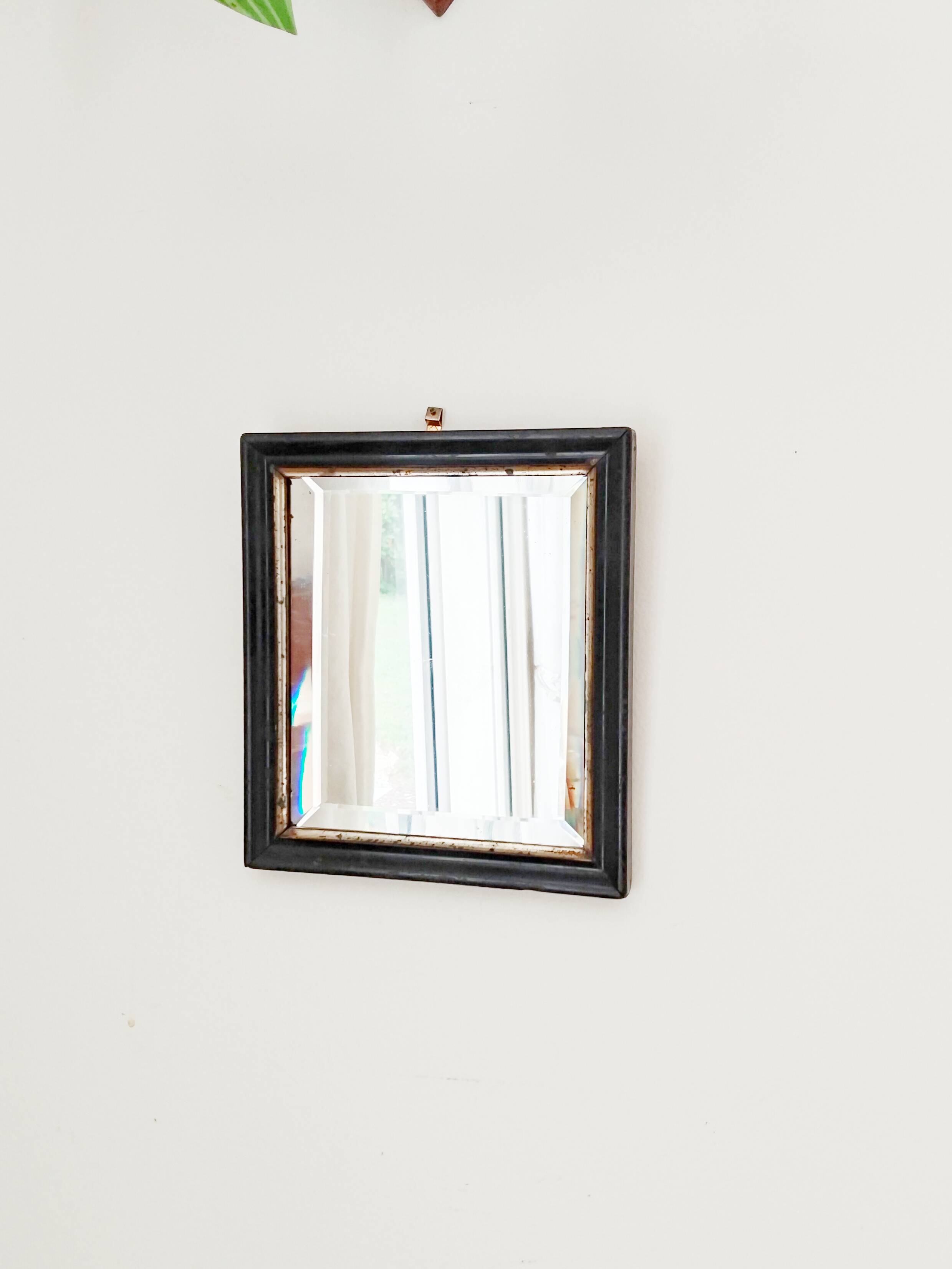 Antique Napoleon III beveled mirror, black and gold