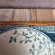 Antique trivet in Gien tile with blue bird decoration – wooden border