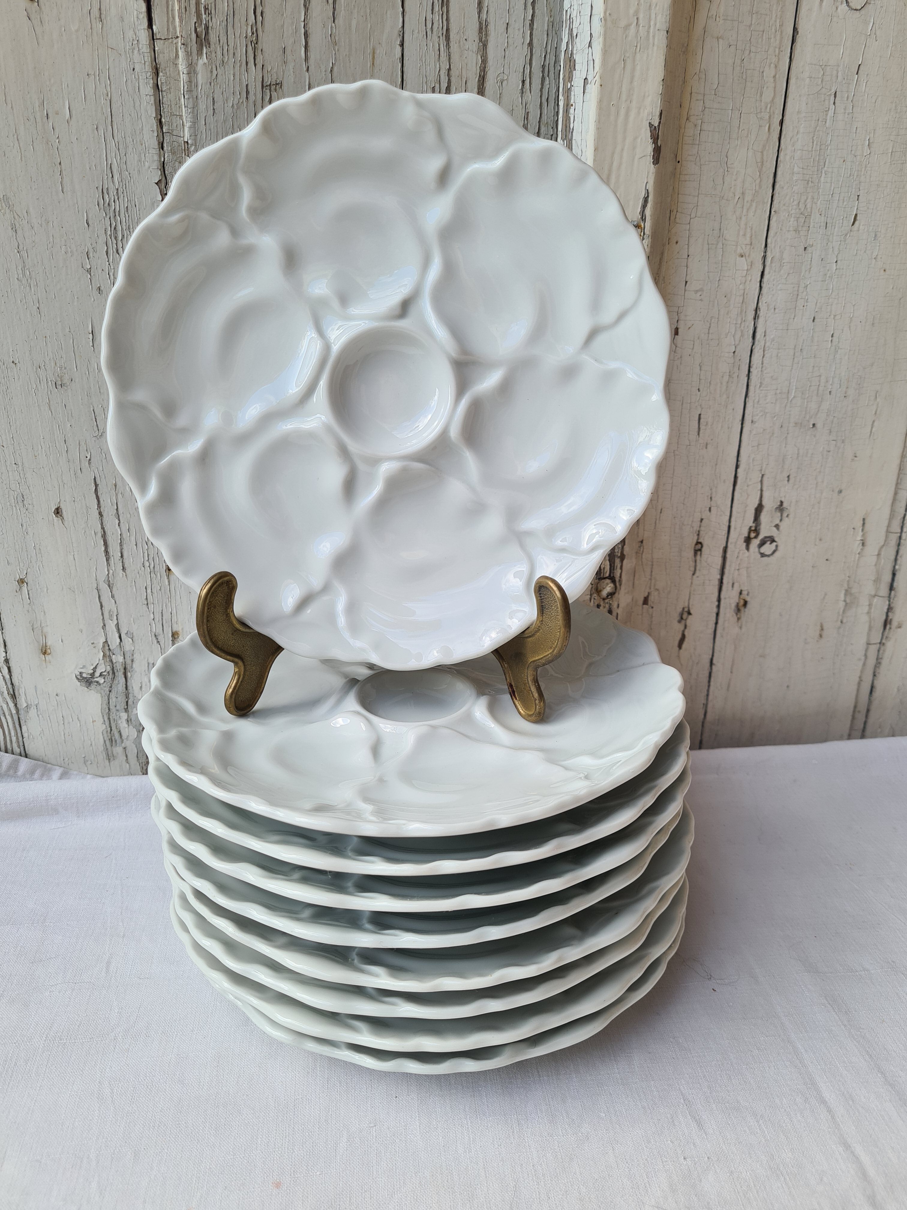 Nine Bavarian porcelain oyster plates