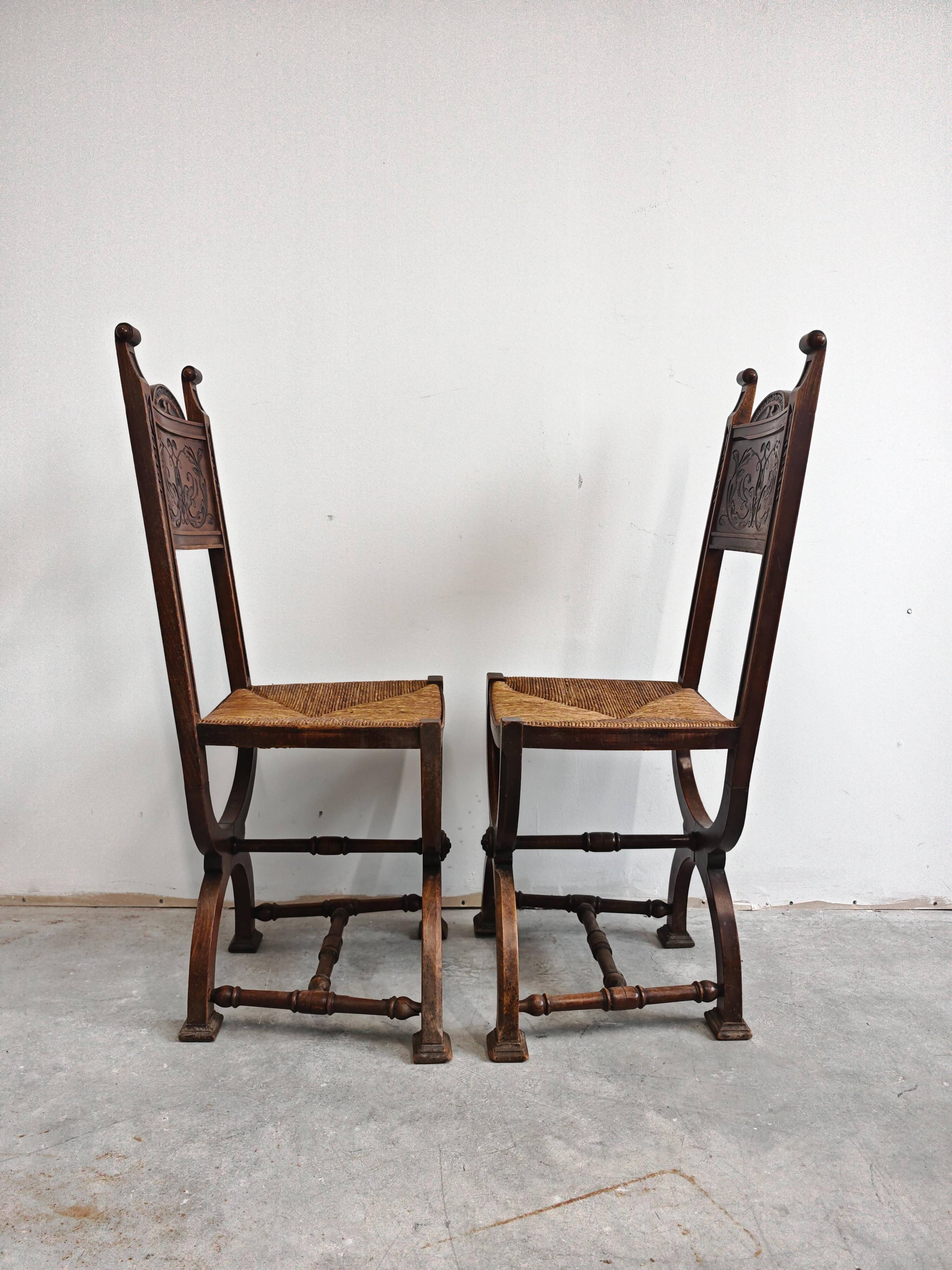Pair of Neo-Renaissance oak chairs with straw seats, 1910