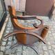 Chesterfield armchair in leather and carved solid wood