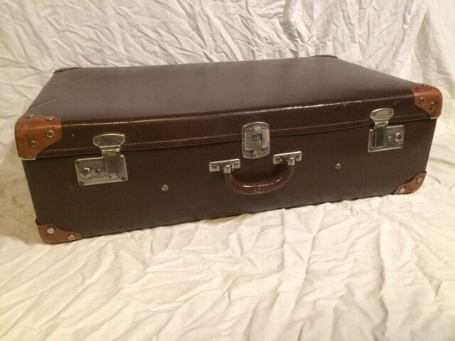 Suitcase vintage leather inside and brown carpeted home