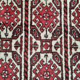 Oriental carpet knotted with red hand