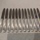 12 silver-plated dessert knives by the silversmith Ercuis, Senlis, 20.3 cm.