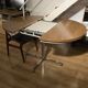 Extendable round table with a space age vintage mid-century formica top.