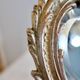 Small vintage 19th century mirror or hand mirror, bronze, beveled glass, baroque, rococo style.
