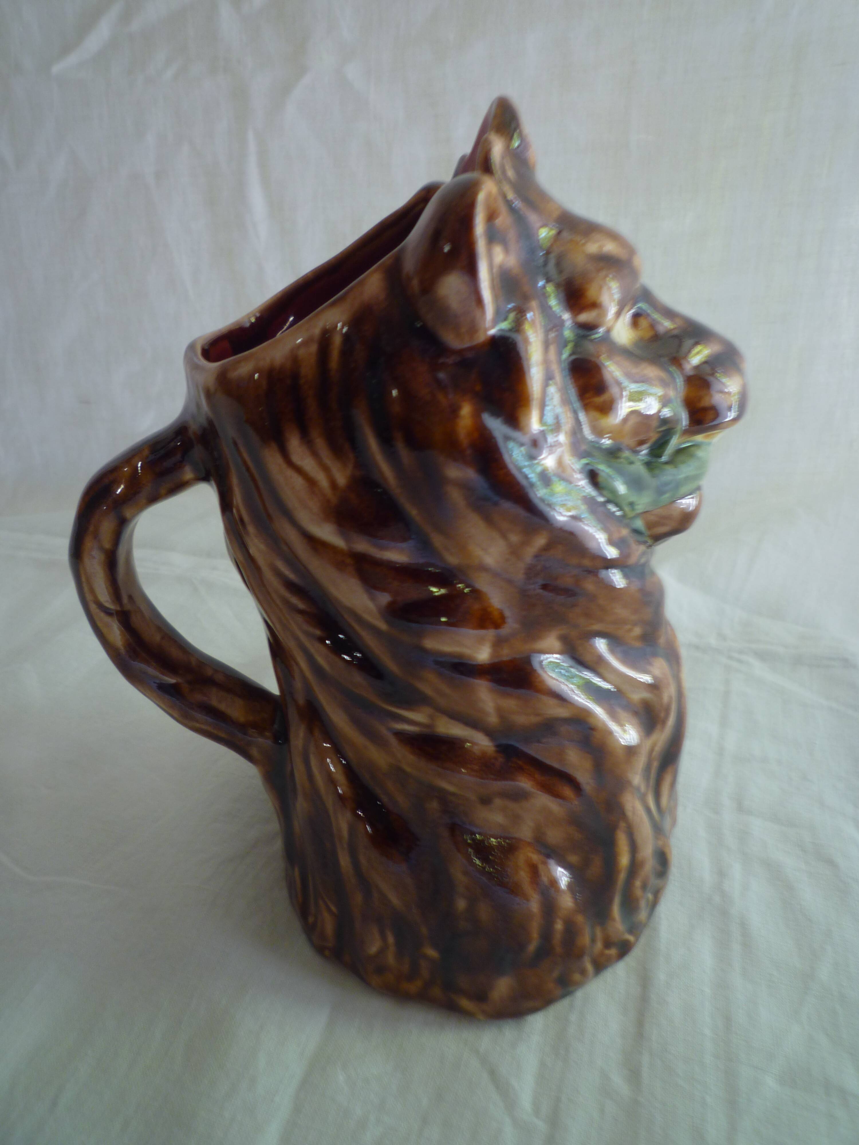 Lion head slip pitcher late 19th century