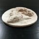 Plaster medallion figure