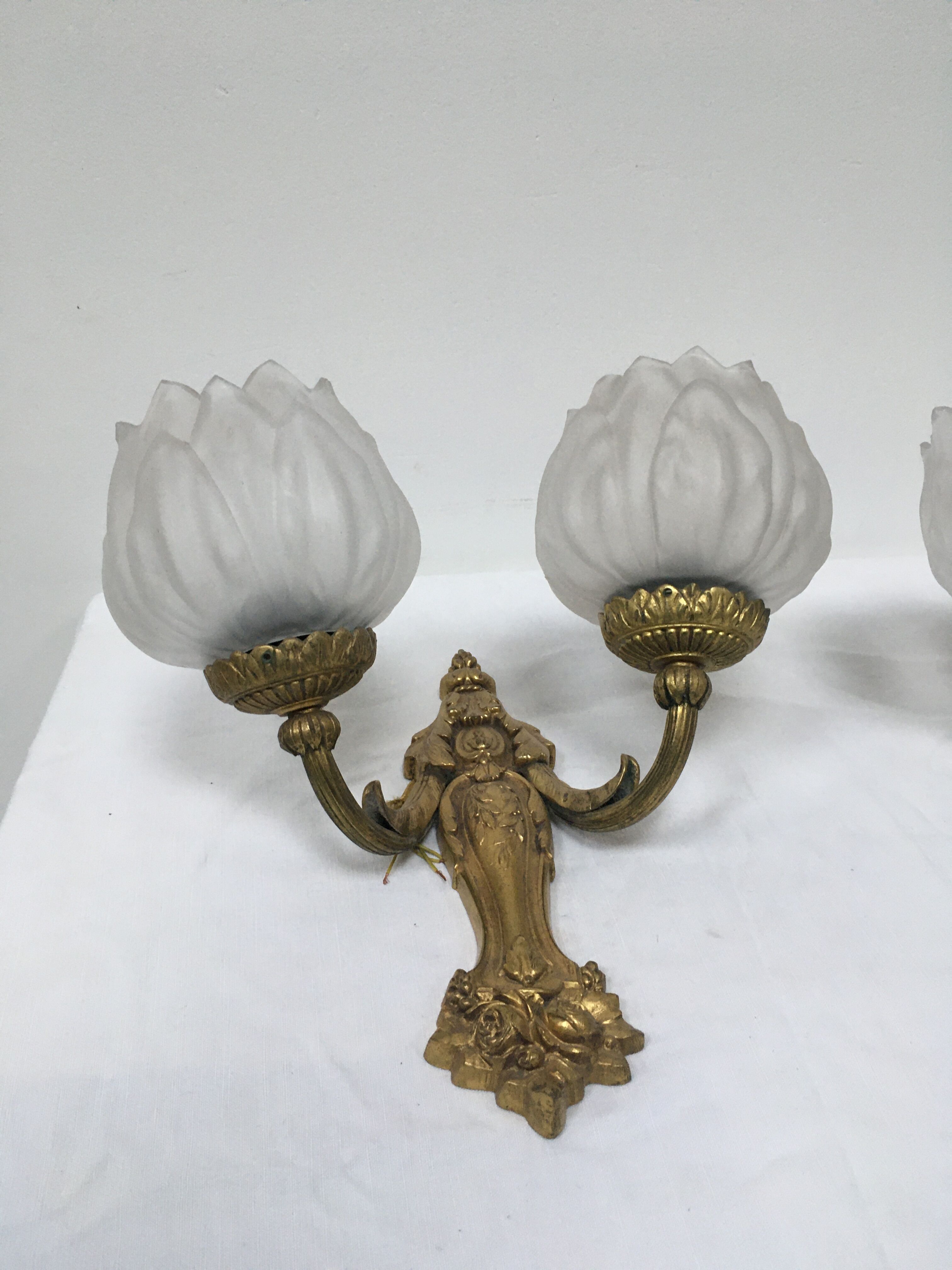 Pair of brass and glass wall light