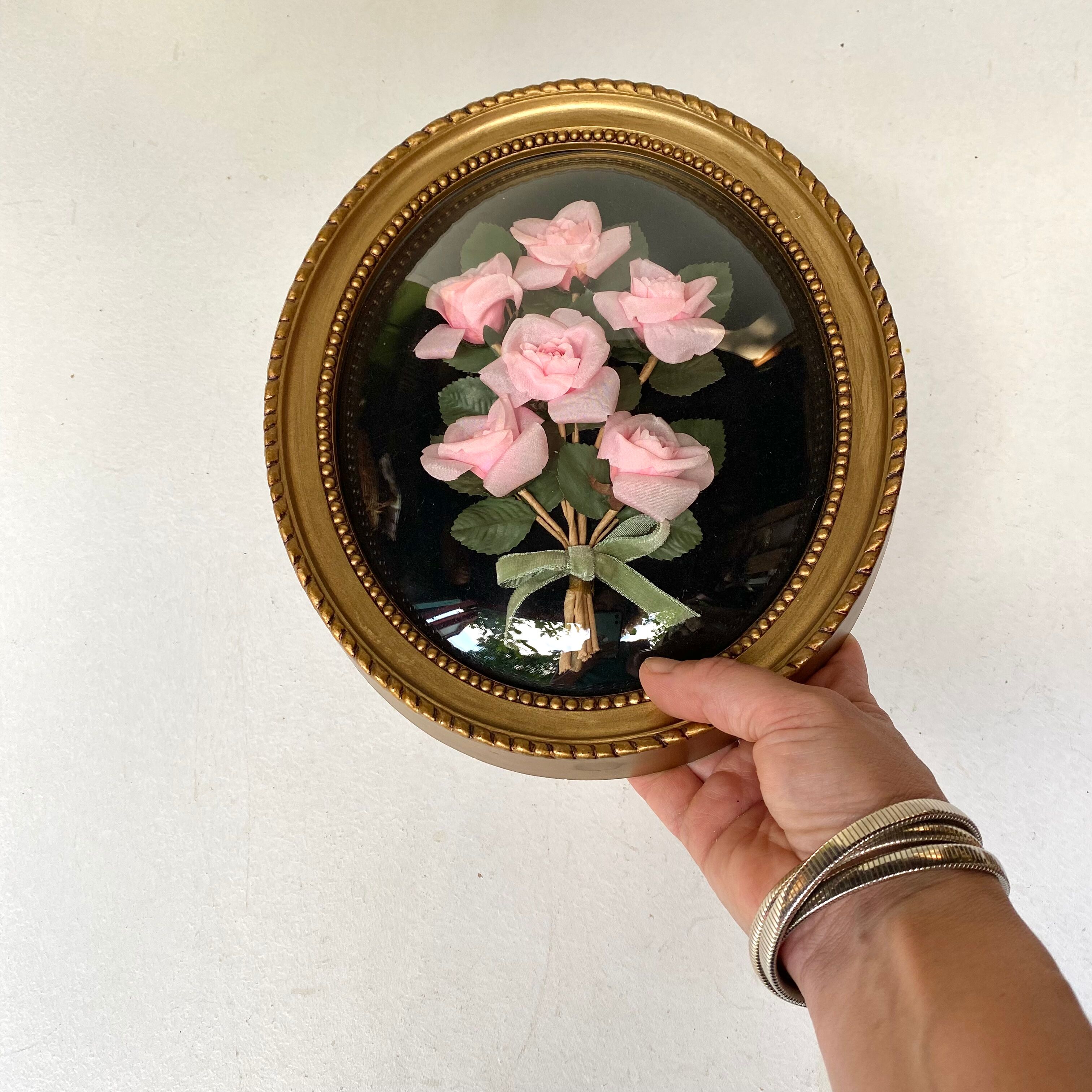 Oval frame domed glass curved roses