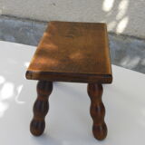Old wooden stool, worked, turned foot, handcrafted