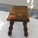 Old wooden stool, worked, turned foot, handcrafted