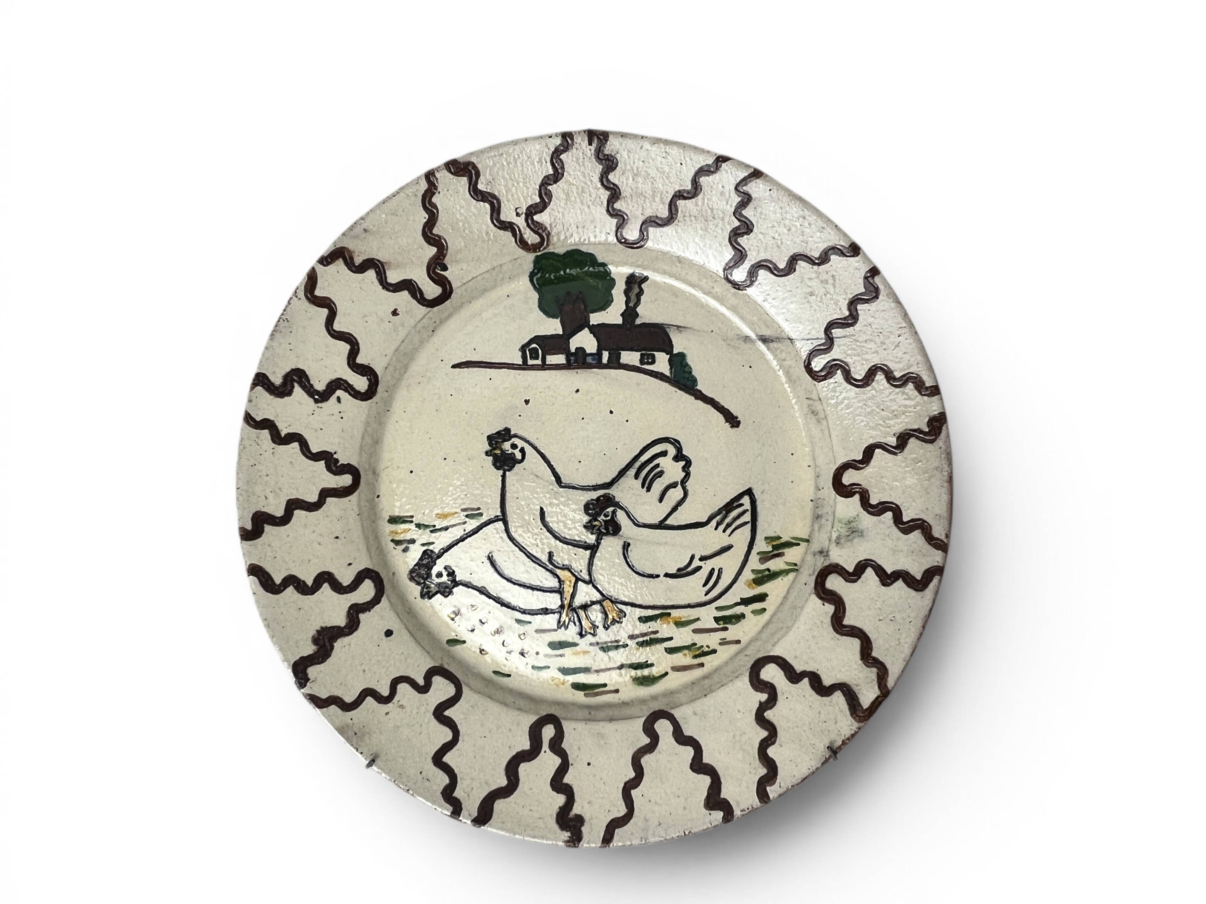 Old terracotta plate decorated with chickens, Portugal, 20th century.