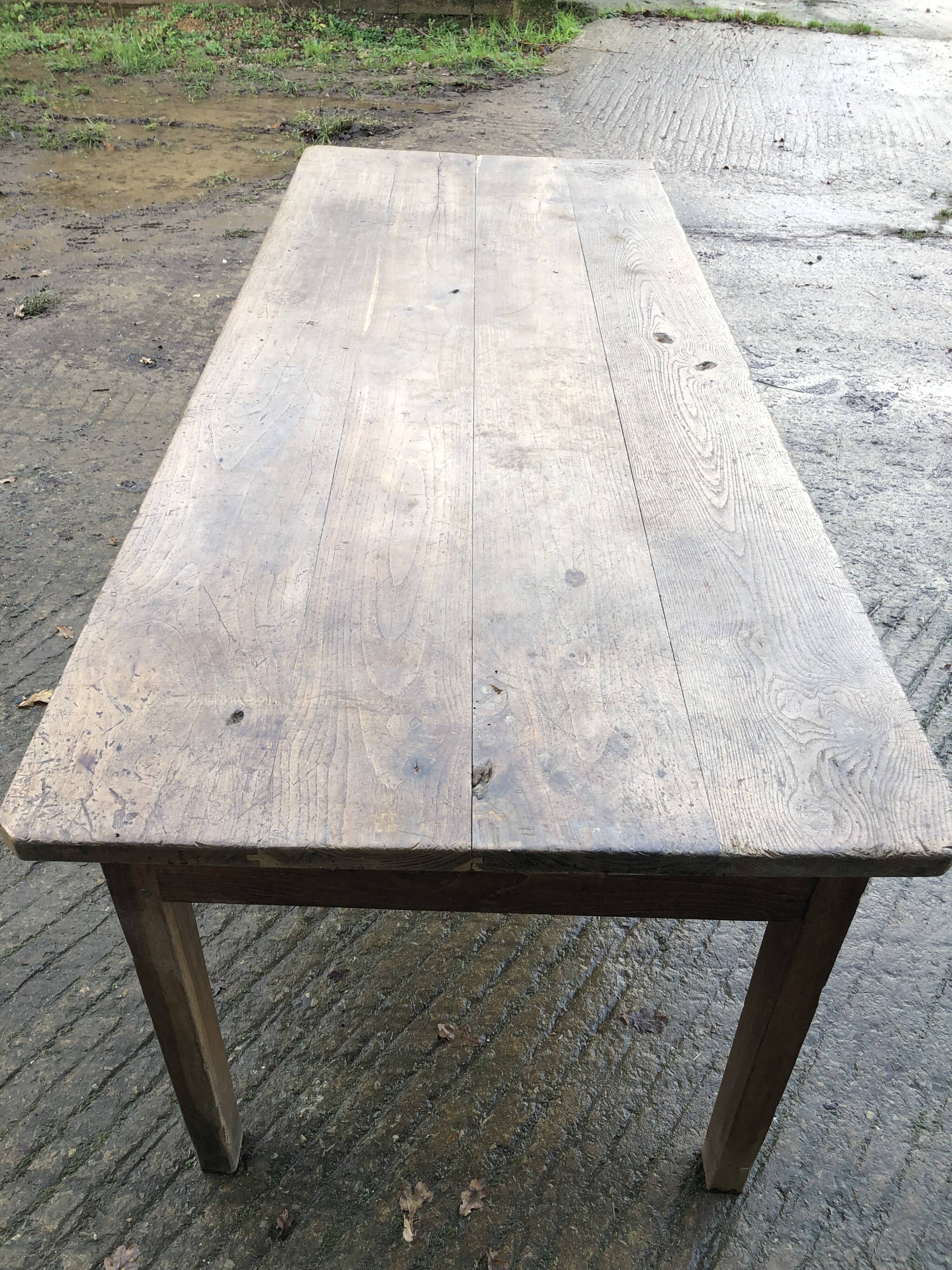 Antique farmhouse table in solid oak with tapered legs and 1 drawer at the end.
