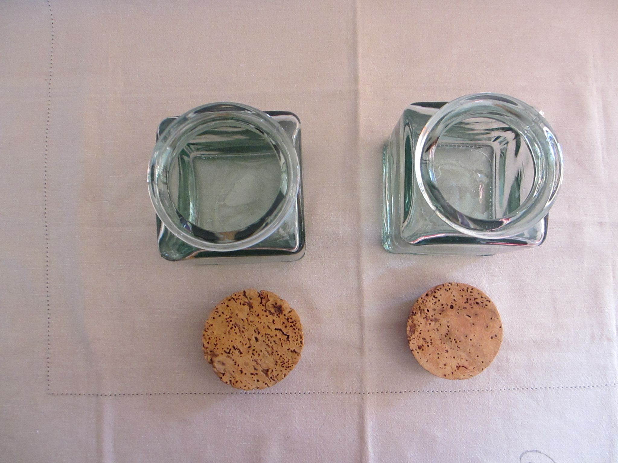 2 glass jars with crusted cork stopper