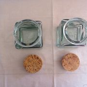 2 glass jars with crusted cork stopper