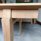Oak dining table with a checkerboard top and extensions.