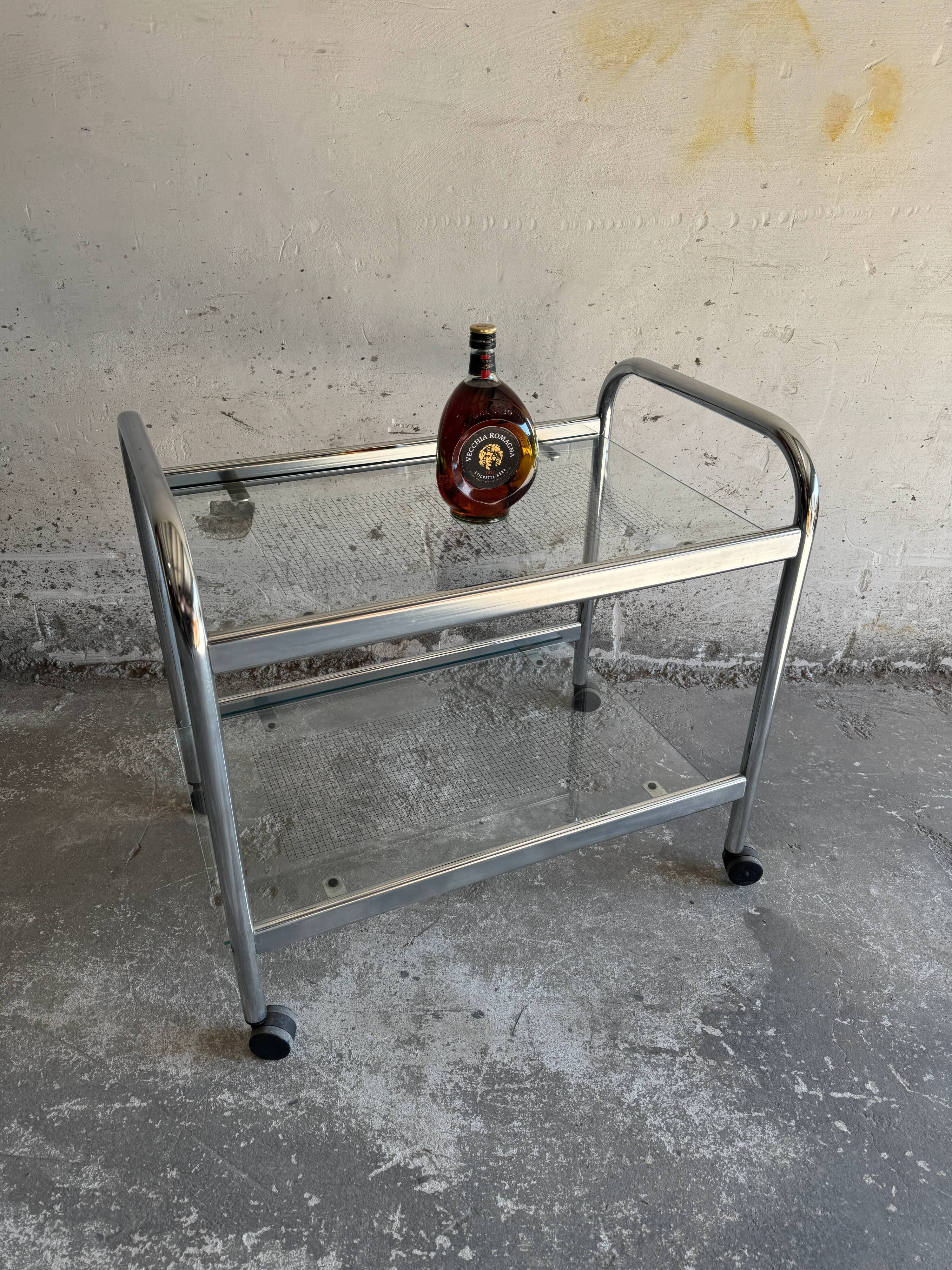 Vintage silver chrome-plated steel and glass two-tier serving trolley with wheels