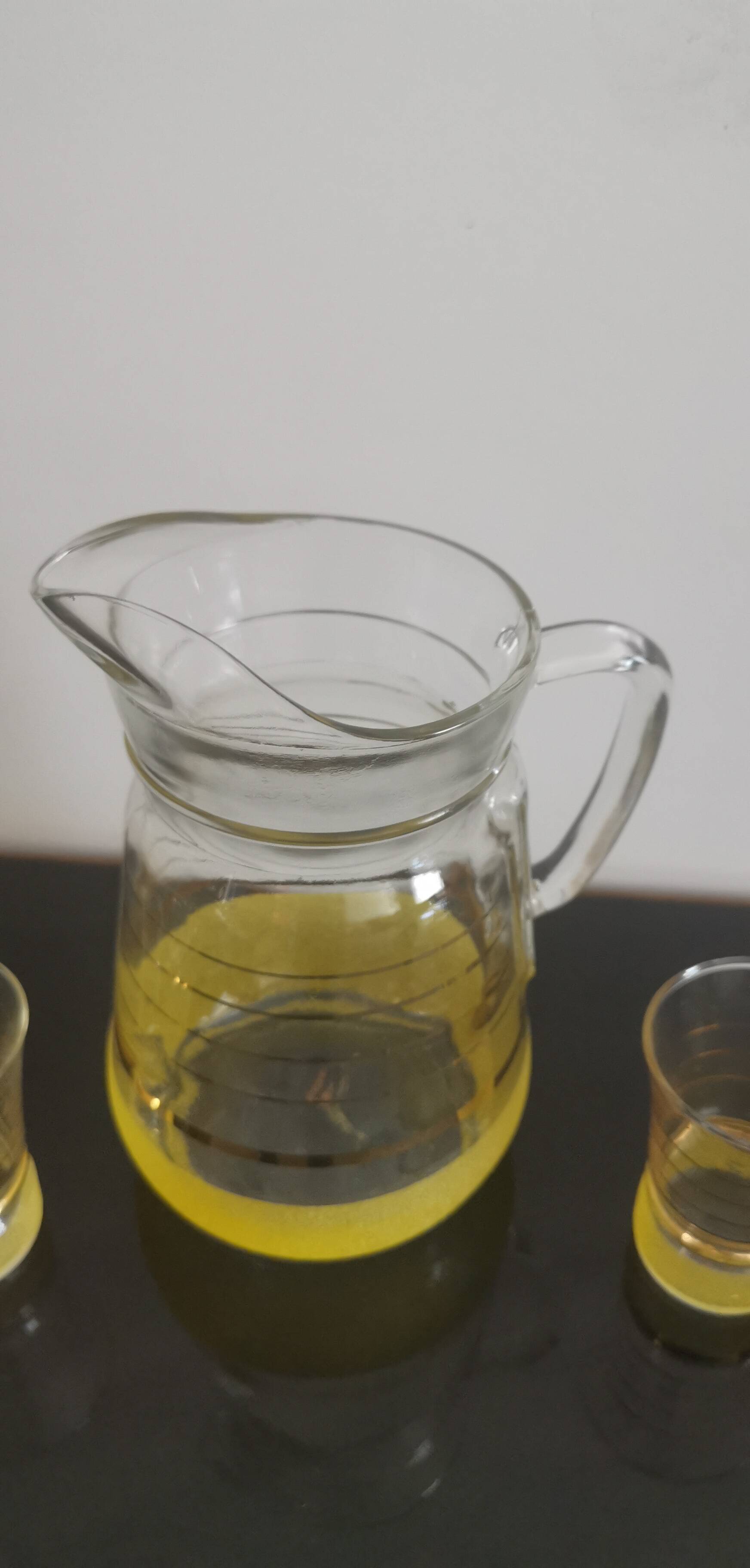 Old pitcher with its 8 yellow granite glasses with gold edging vintage 50's