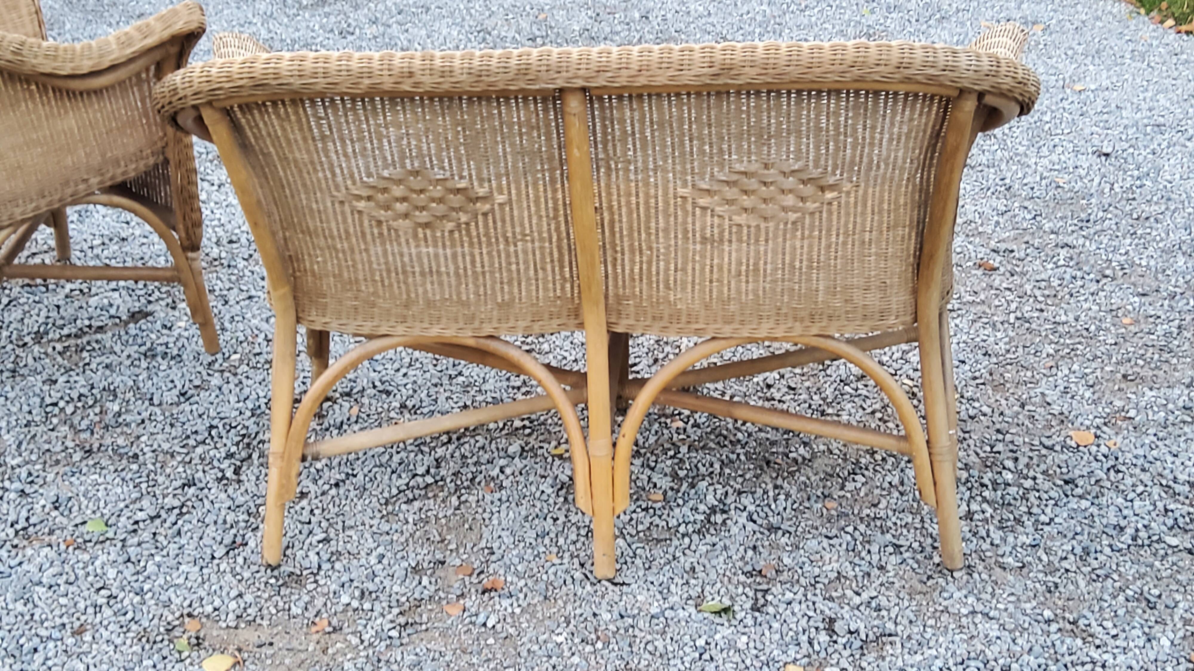 Pair of armchairs and bench in rattan and bamboo from the 60s/70s