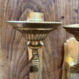 Pair of bronze wall sconces with outstretched arms and hands