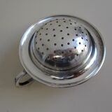 Silver metal tea strainer