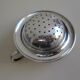 Silver metal tea strainer