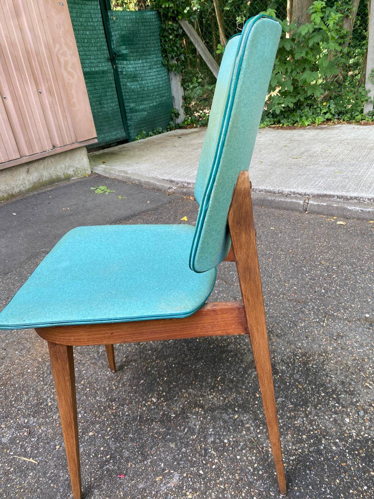 4 Scandinavian dining chairs in solid wood and blue-green leather from the 1950s.