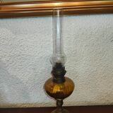 Antique kerosene lamp with yellow glass