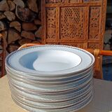 Twelve white porcelain plates