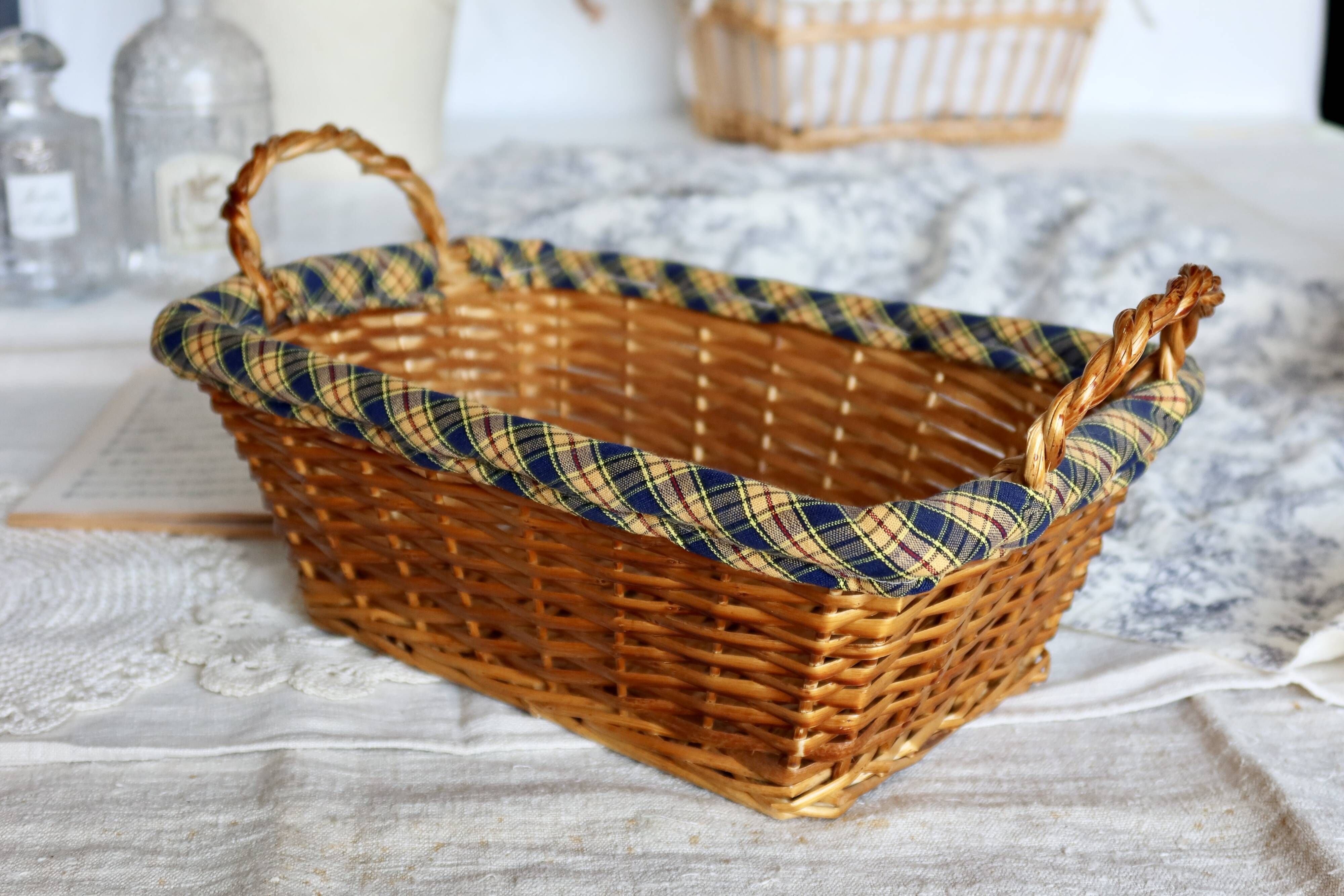 Vintage wicker basket with blue and yellow checkered lining