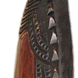 African wooden mask, face topped with a bird.