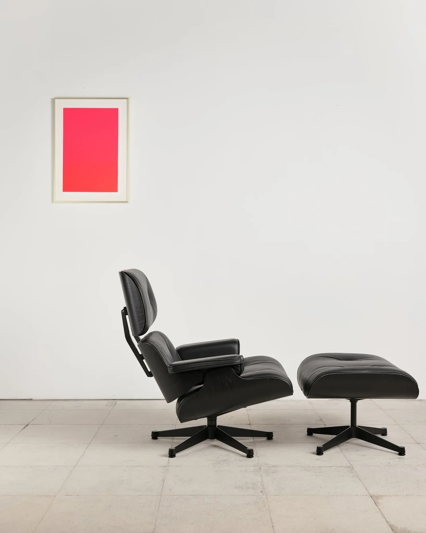 Lounge Chair and ottoman in black leather by Charles & Ray Eames, Vitra