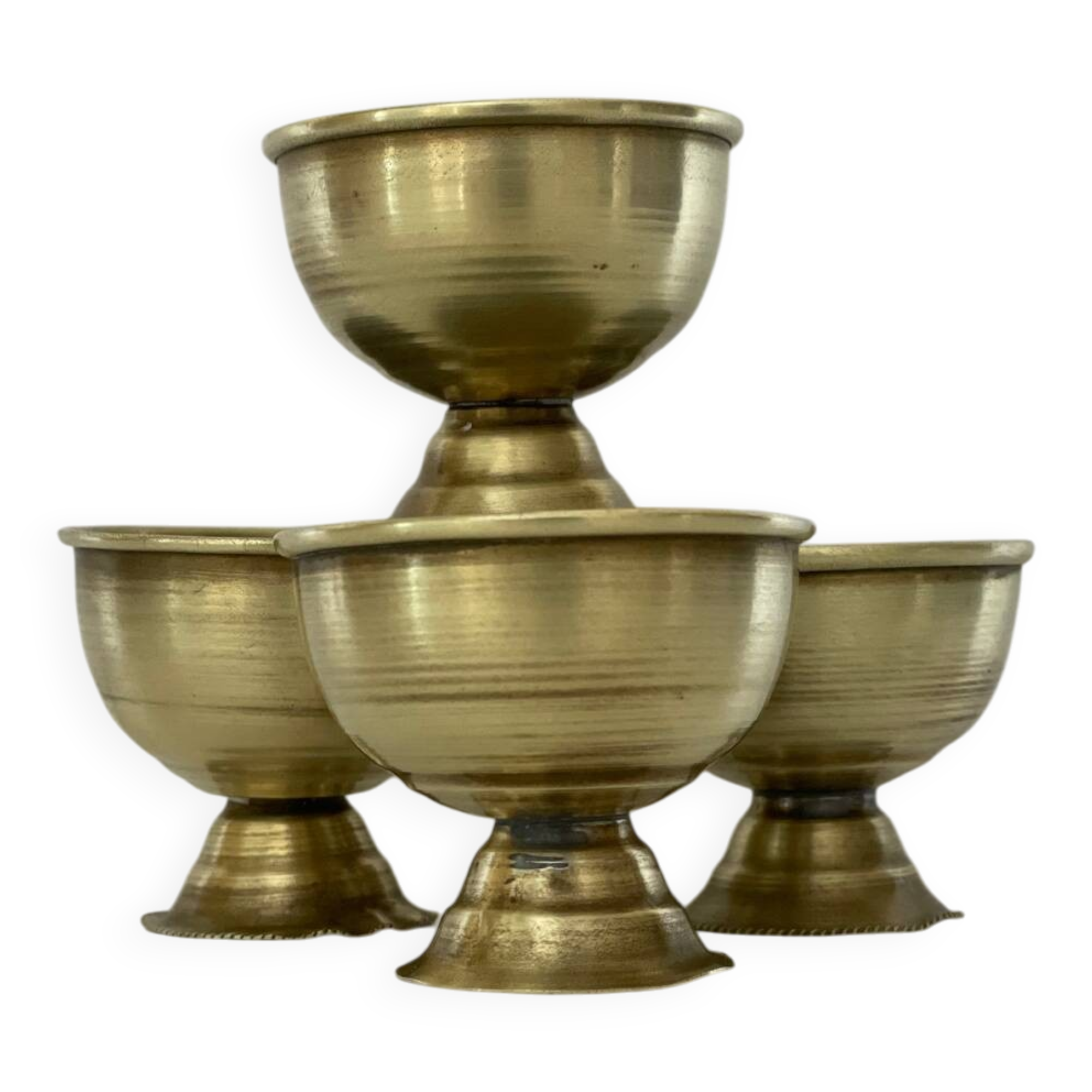 4 golden brass egg cups