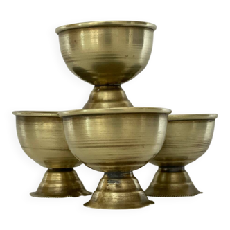 4 golden brass egg cups