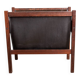 Danish magazine rack in rosewood and leather, 1960.