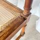 Antique banquette in Louis XIII style, turned wood with caning, late 19th to early 20th century.