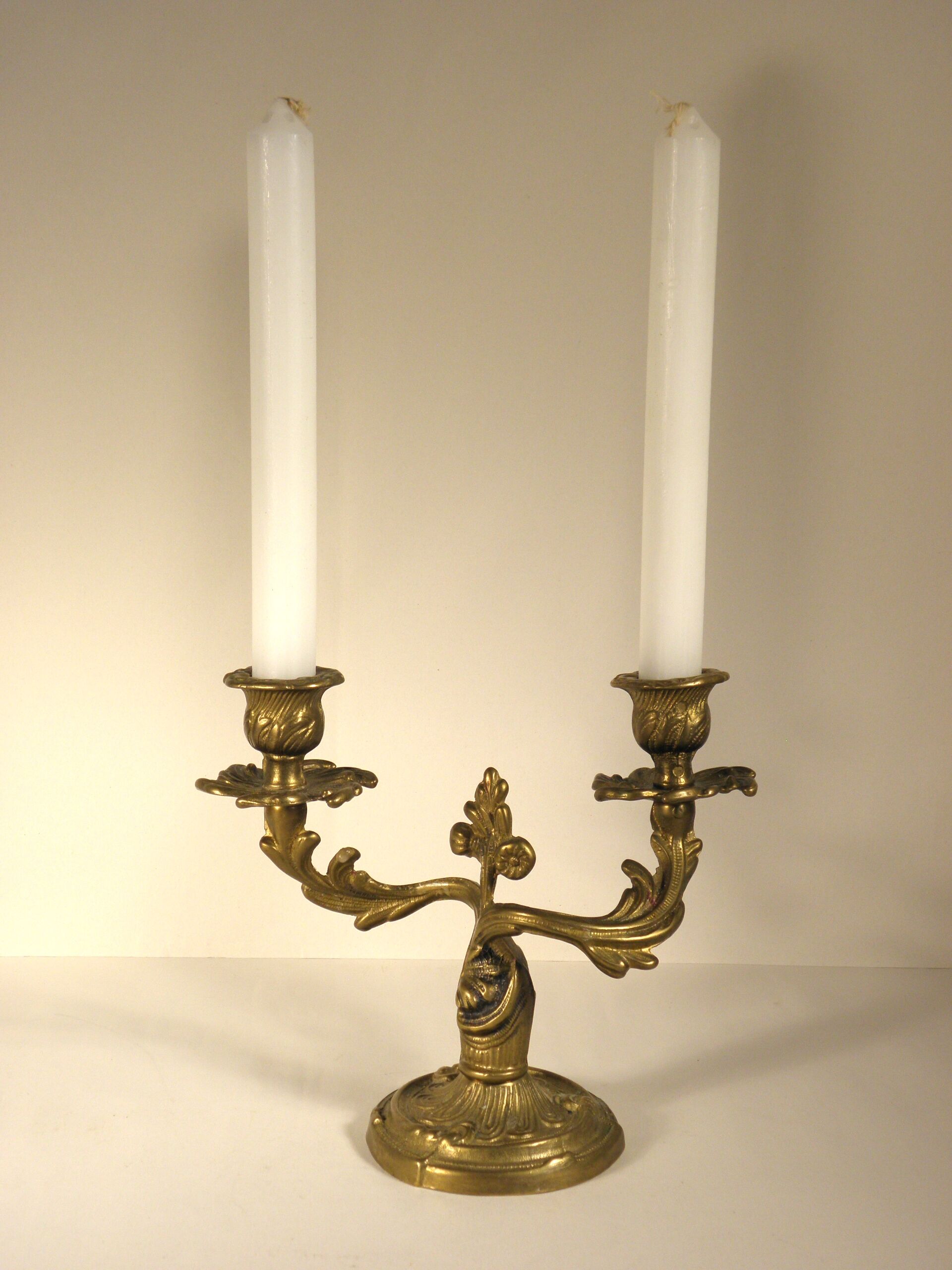 Two-branched candlestick in gilded bronze