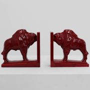 Pair of red glazed ceramic Bison ox bookends in Art Deco style, Belgium