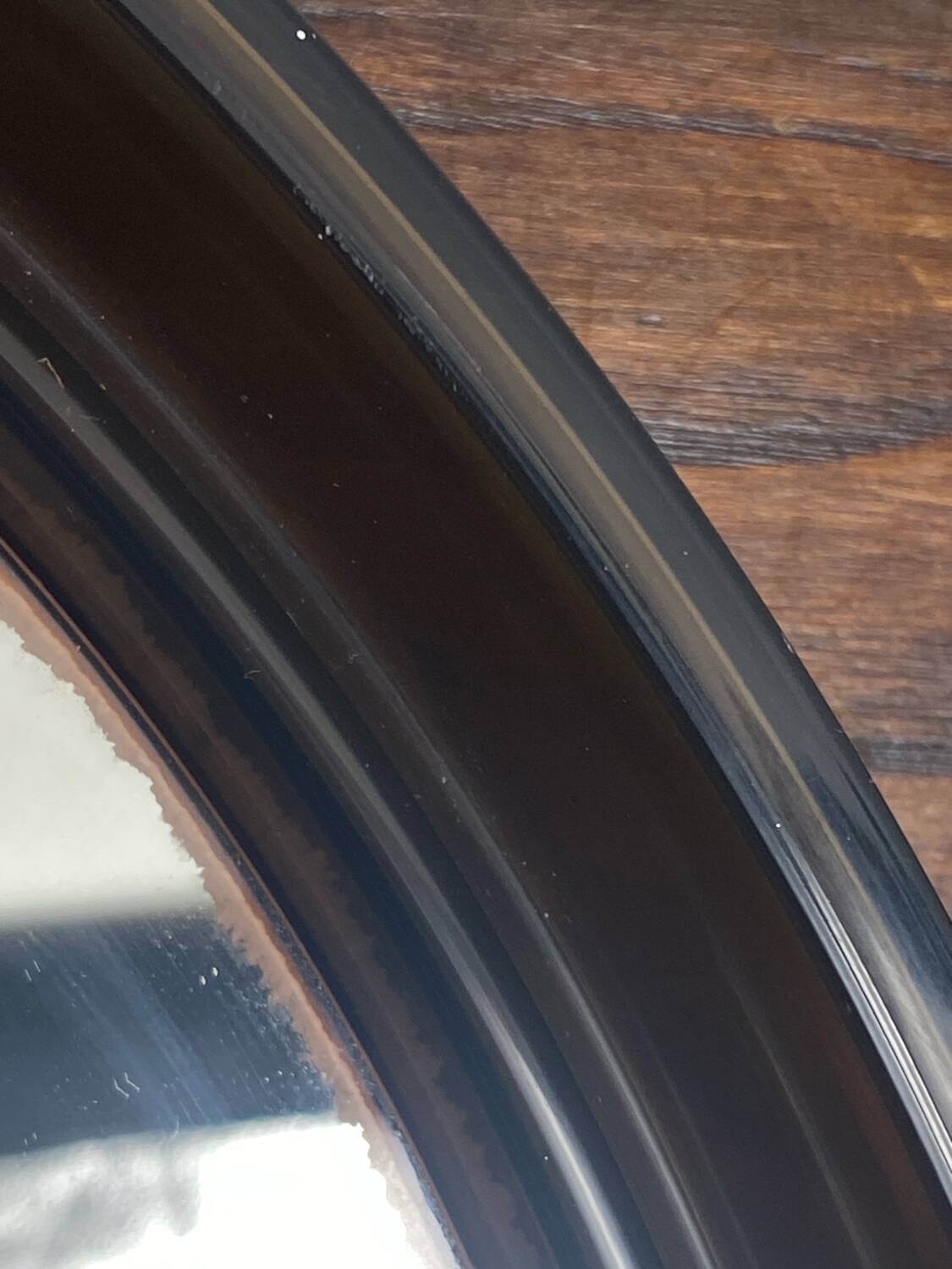 Circular mirror, smoked plastic, 1960s/70s.