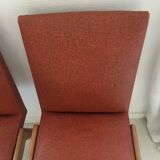 Red vintage chairs and compass feet