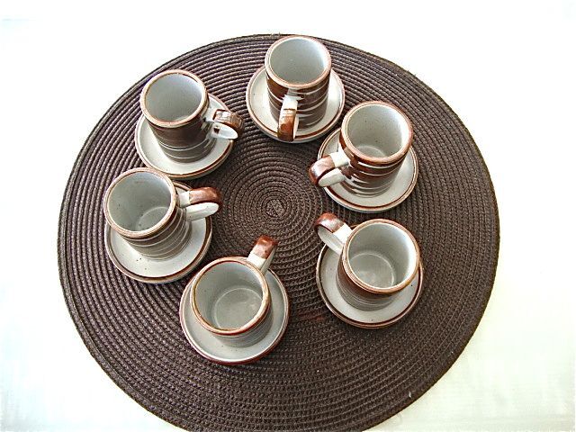 6 coffee cups and sandstone subcups