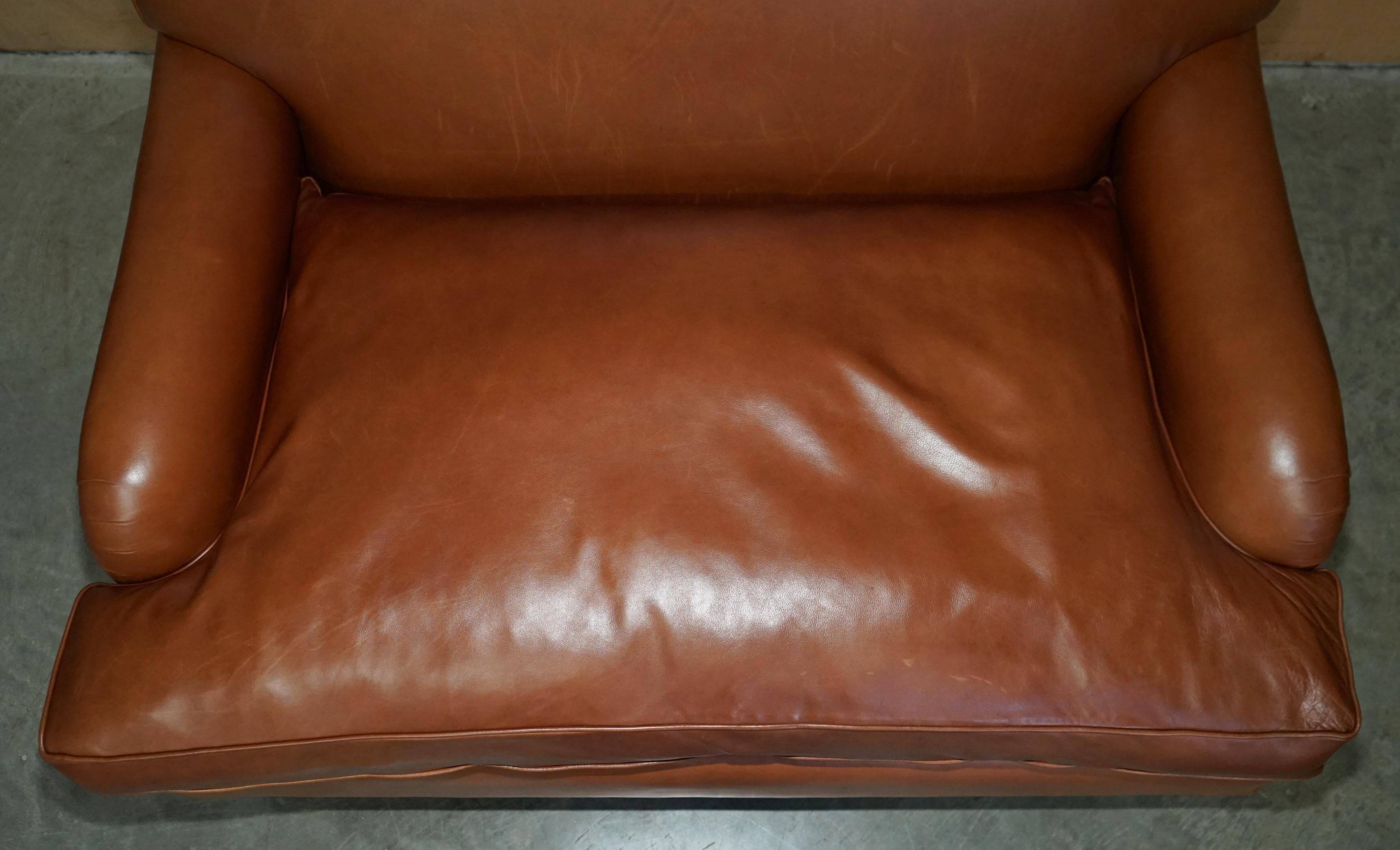Two-seater leather armchair in Howard style by George Smith.