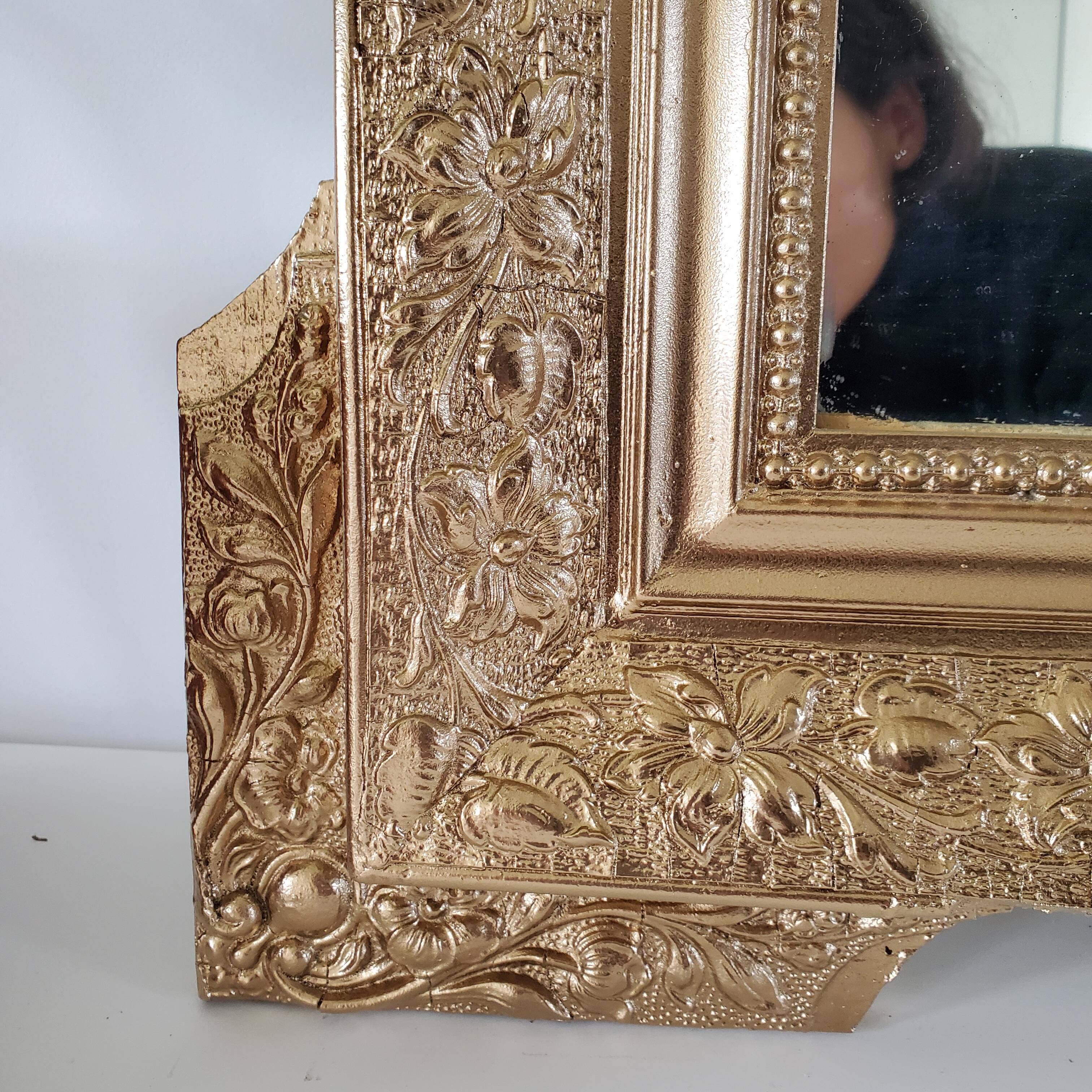 Antique mirror with gilded wood crests