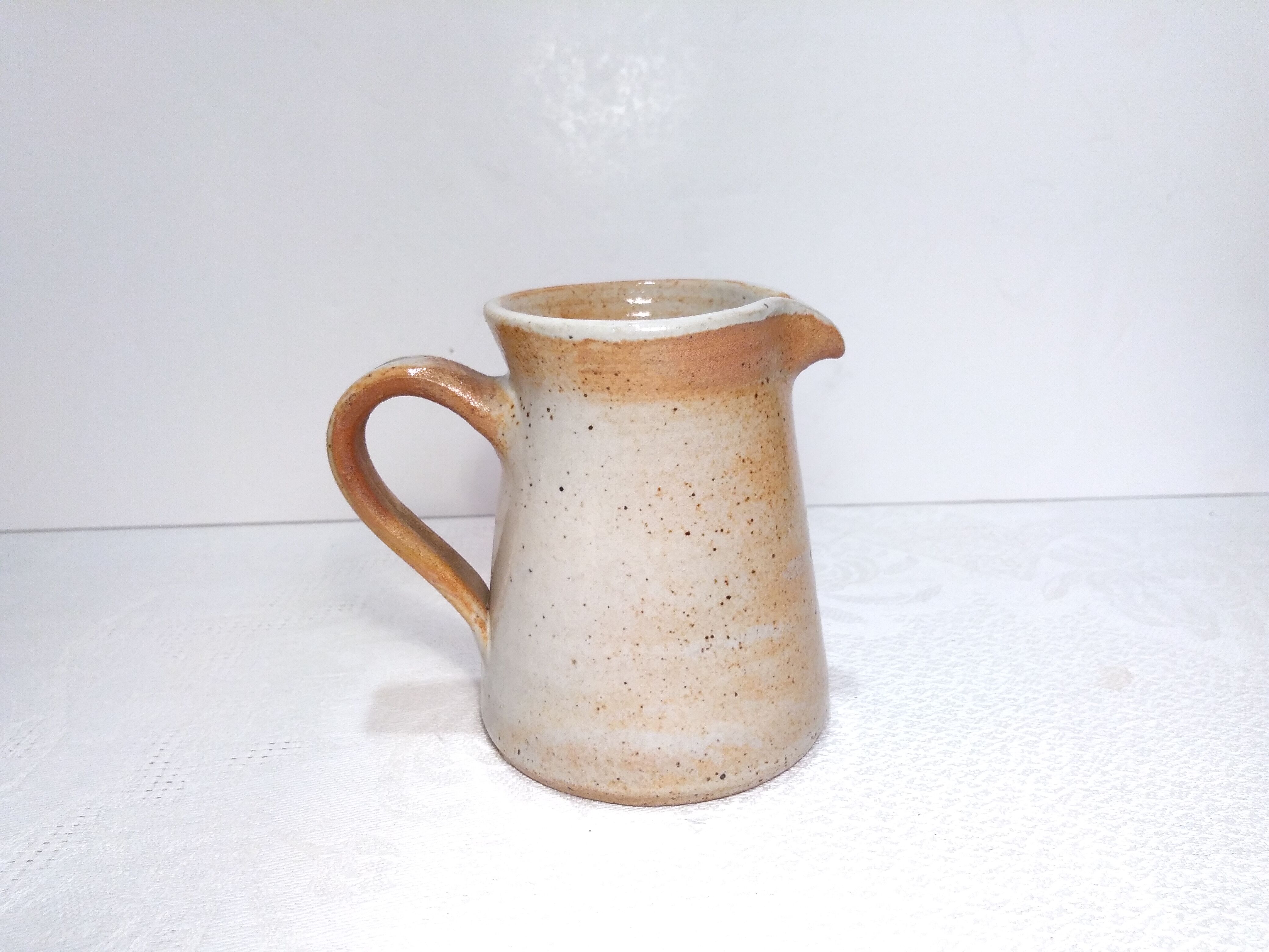 Vintage creamer in marsh sandstone