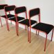 Lot de 4 chaises empilables en métal rouge et noir des années 1970 : Chaise de salle à manger Space Age
