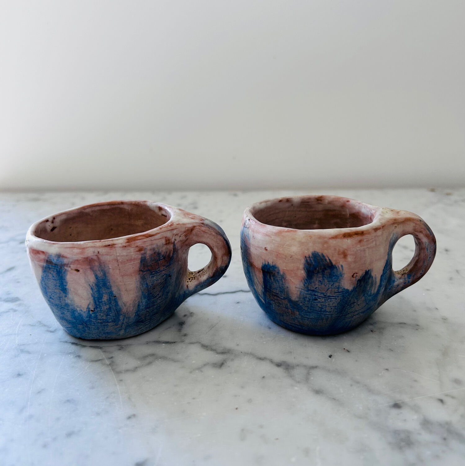 Set of artisanal pitcher and weathered cups