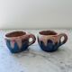 Set of artisanal pitcher and weathered cups